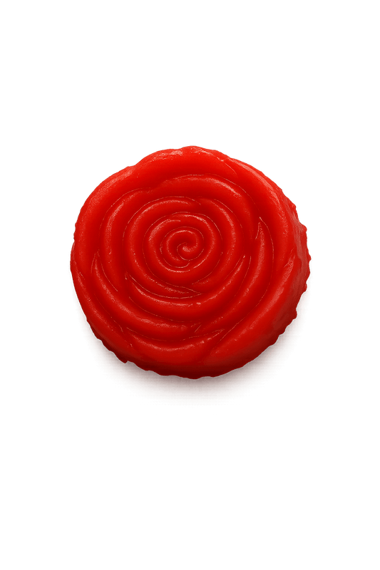 Red circular object with concentric patterns on a black background