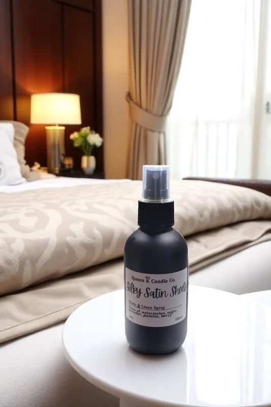 Bottle of 'Silky Satin Shine' product on a table in a bedroom setting