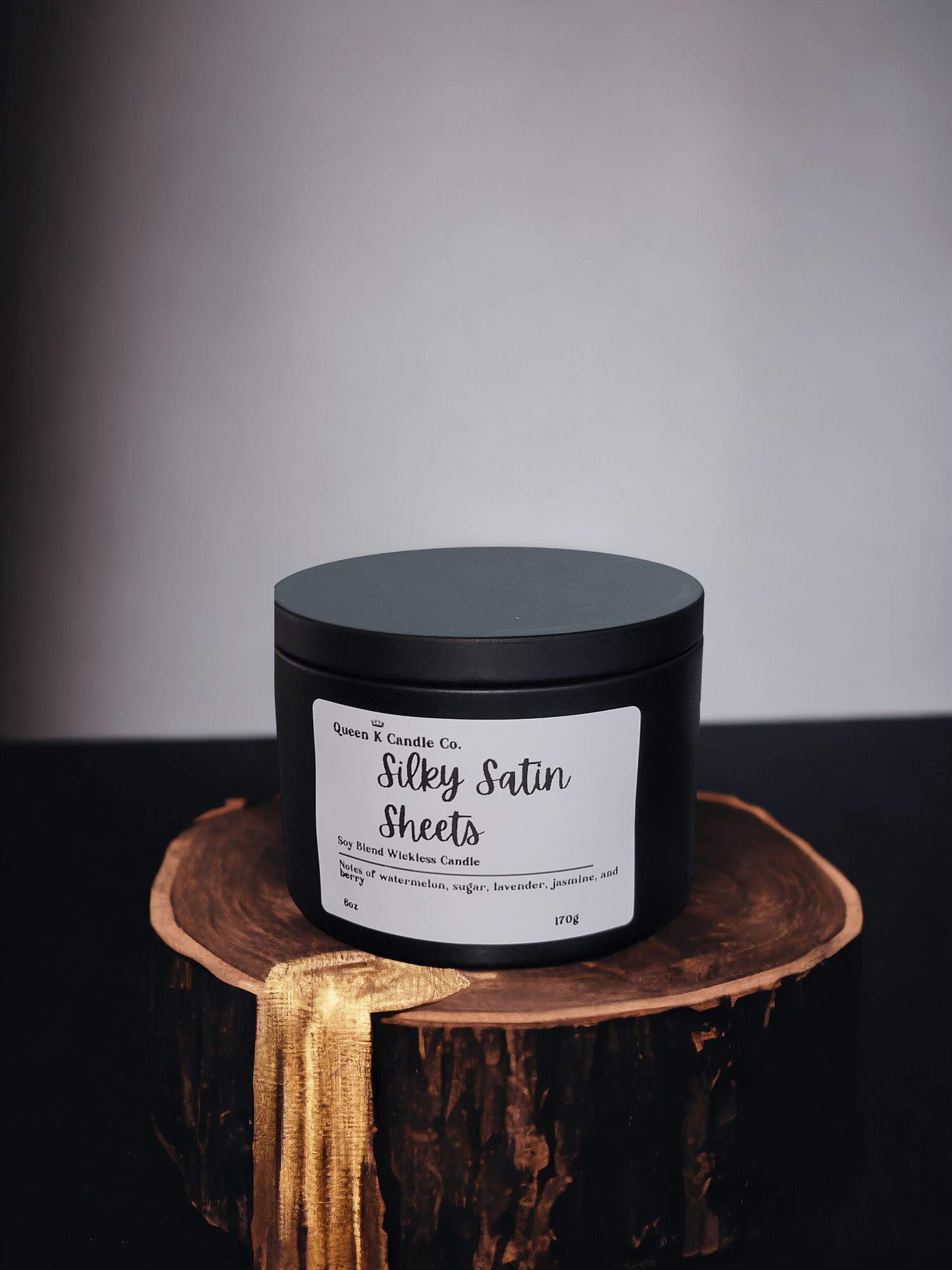silky satin sheets candle