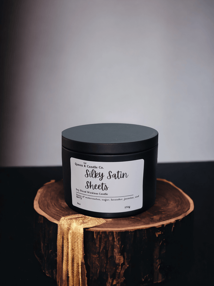 silky satin sheets candle