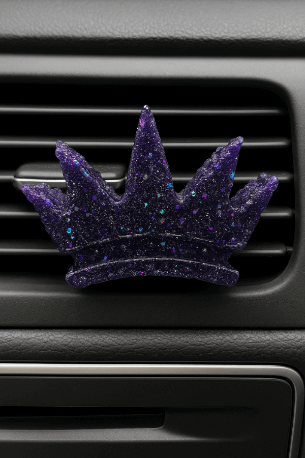 Midnight Reserve car vent clip in a crown shape, featuring a rich purple design. Experience sophistication on the go.