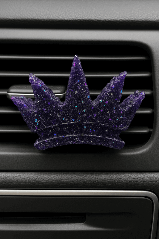 Midnight Reserve car vent clip in a crown shape, featuring a rich purple design. Experience sophistication on the go.