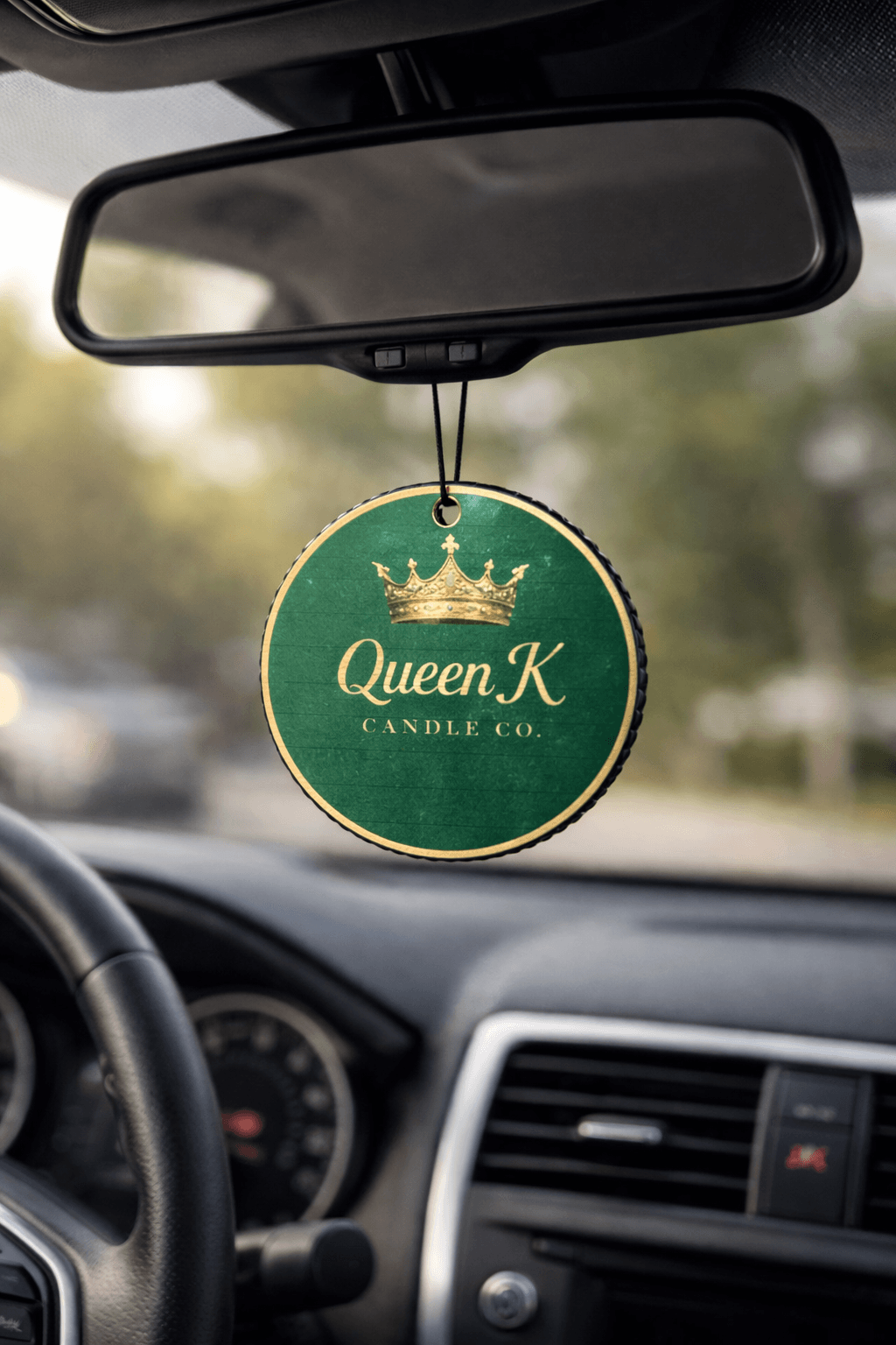 Car air freshener hanging from a car's rear view mirror.