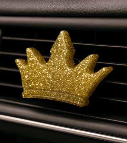 Midnight Reserve car vent clip featuring a sparkling gold crown design for stylish fragrance on the go.