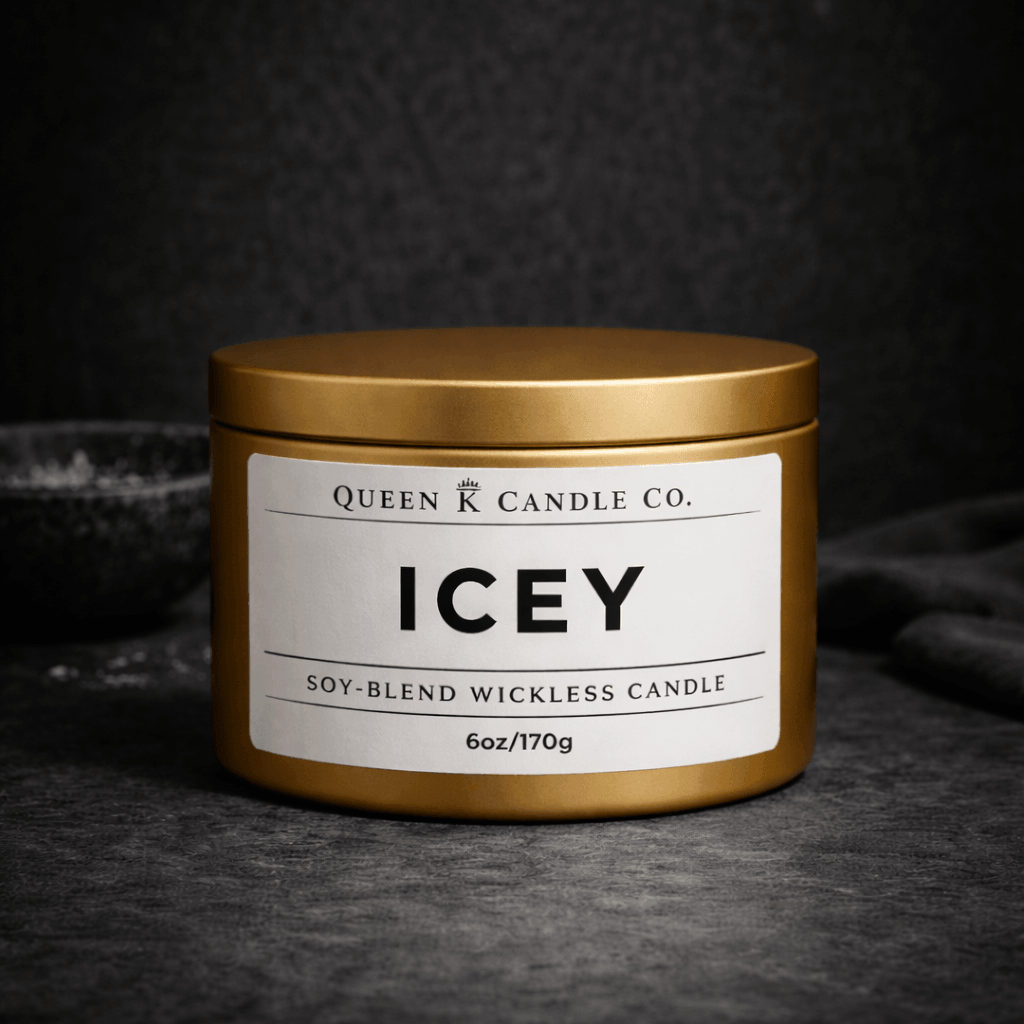 Gold candle jar with 'Icey' label by Queen Candle Co. on a dark background