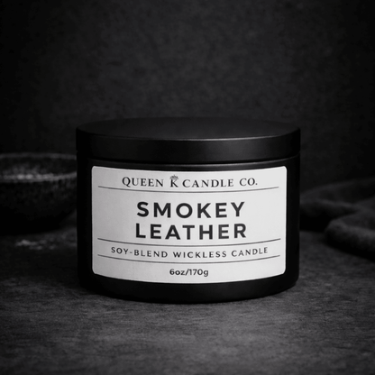 Smokey Leather candle from Queen Candle Co. on a dark background