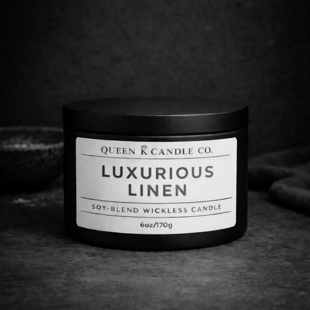 Black candle jar with 'Luxurious Linen' label on a dark background
