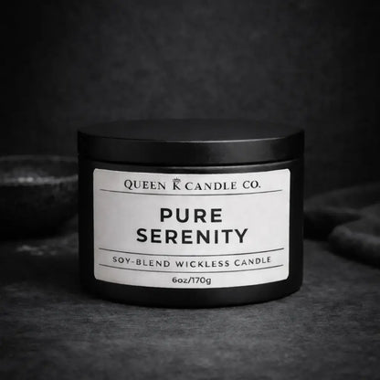 black candle tin labeled Pure Serenity