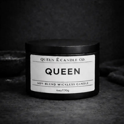 black candle tin labeled Queen