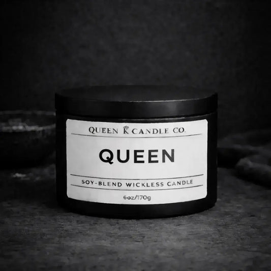 black candle tin labeled Queen