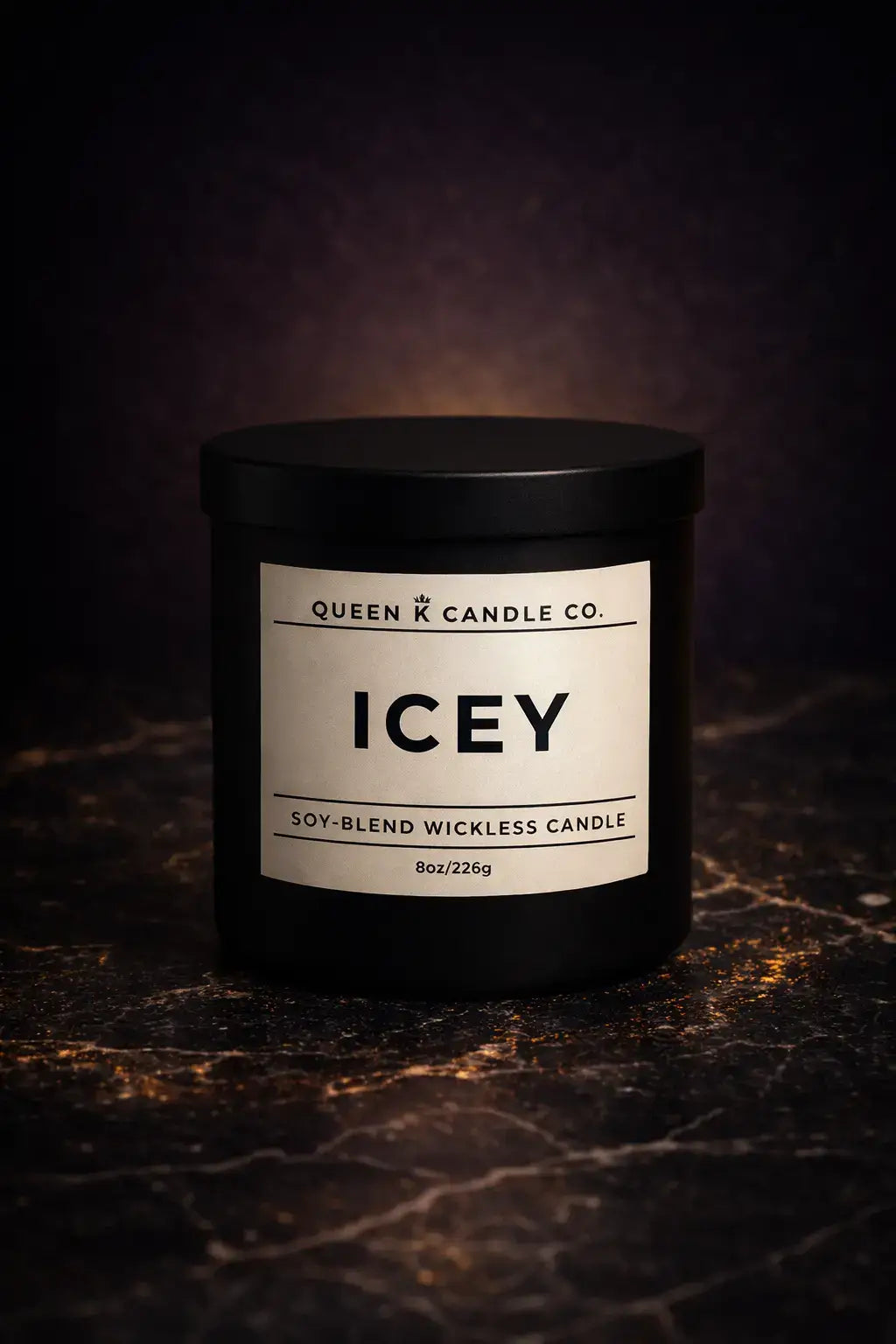 Candle labeled 'Icey' from Queen Candle Co. on a dark textured surface.