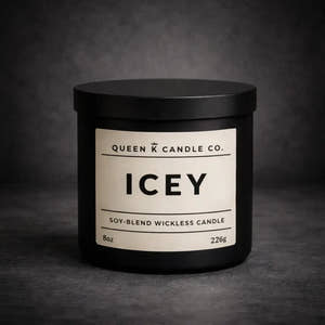 Black candle jar with 'Queen K Candle Co.' label on a dark background