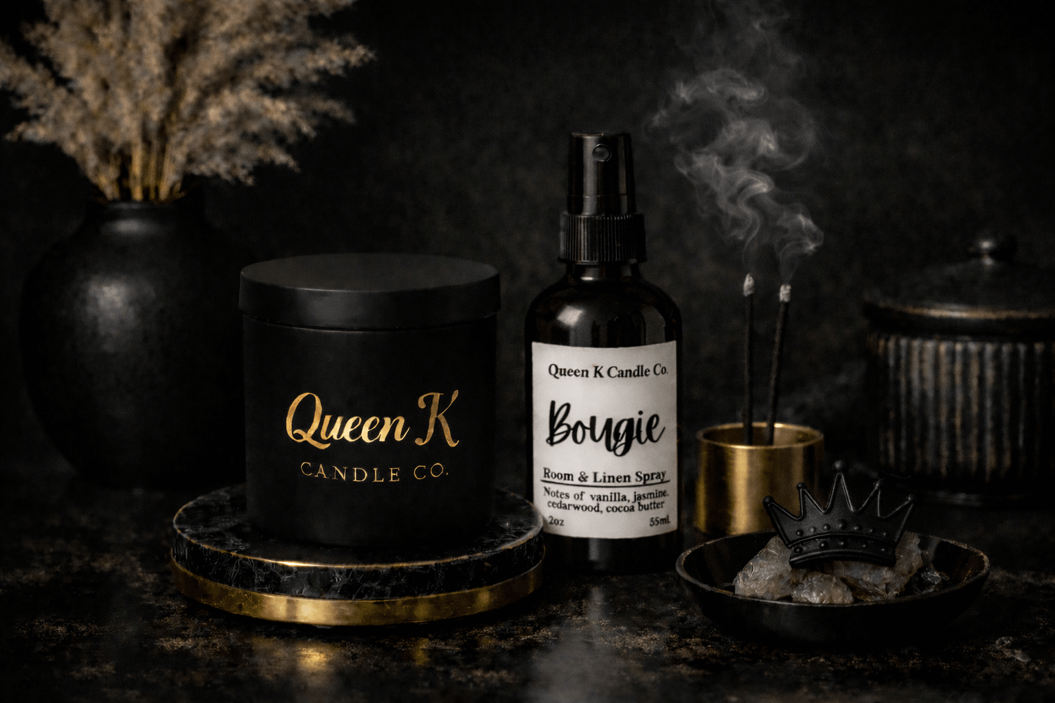 Queen K Candle Co products including a candle, spray bottle, and incense on a dark background