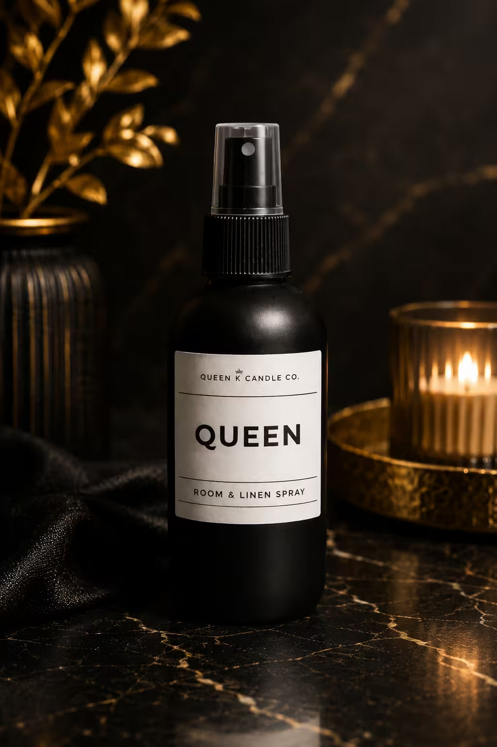bottle of room and linen spray labelled Queen