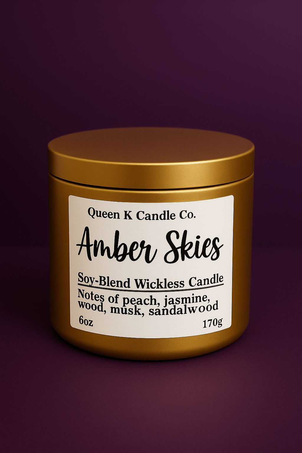 Candle jar labeled 'Amber Skies' by Queen K Candle Co. on a dark purple background