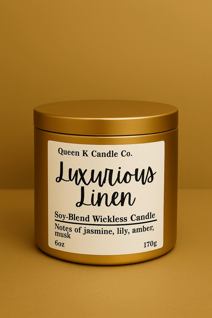 Gold candle jar with 'Luxurious Linen' label on a brown background