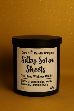 Candle with 'Silky Satin Sheets' label on a gold background