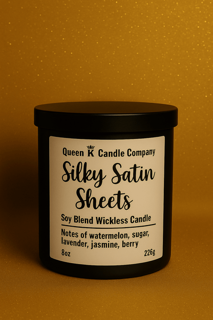 Candle with 'Silky Satin Sheets' label on a gold background