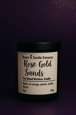 Candle jar with 'Queen K Candle Company' label on a dark background